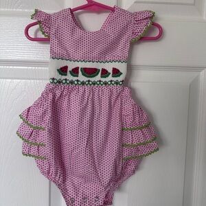 Pink Polka Dot Ruffle Romper. Worn once. Perfect condition. 9 months